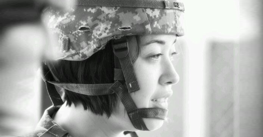 Close-up of Valerie wearing fatigues